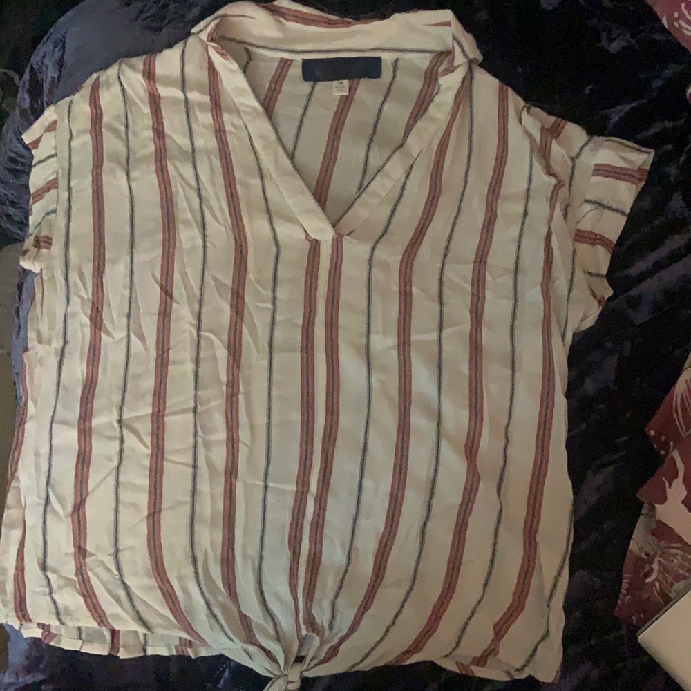 This is a Blue Rain medium cream top